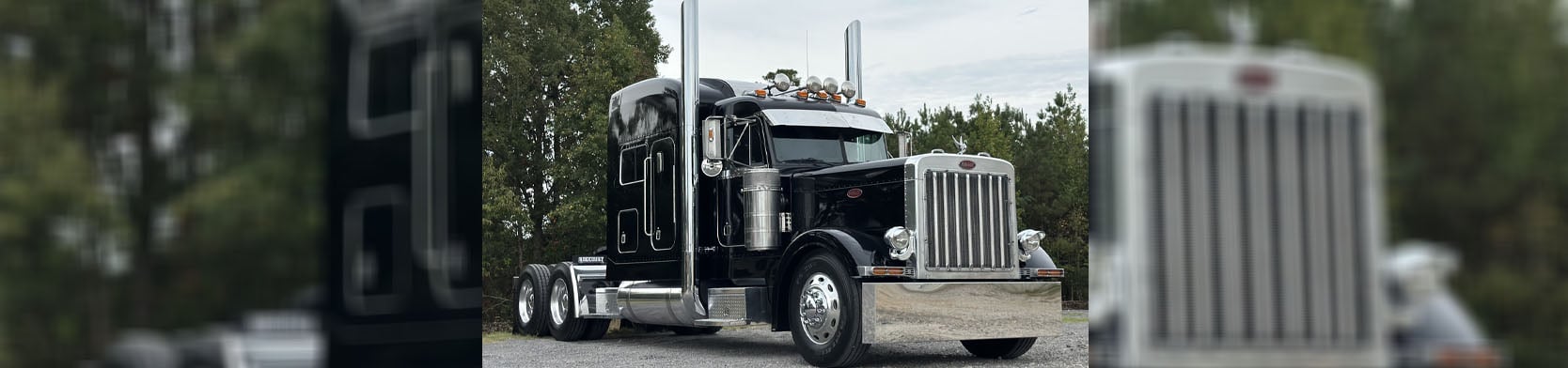County Road 12 Truck Sales Black peterbilt truck left view
